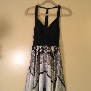 Handkerchief halter dress in shiny silver and black by Sangria
